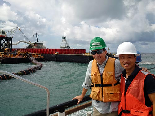 Photo: Economists observing dredging