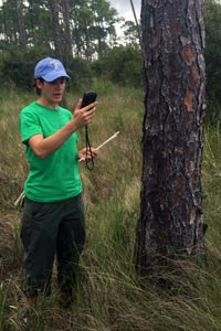 Photo: Jill Trepanier conducting research in the field.