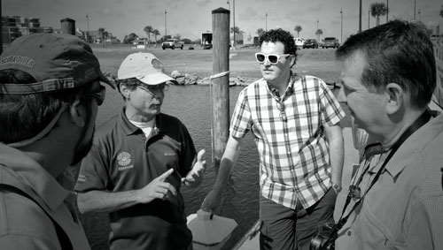 Louisiana Department of Wildlife and Fisheries biologist Mark Schexnayder (second from left) discusses Bucktown Marina redevelopment following Hurricane Katrina with New Jersey Extension leader Peter Rowe (left), NJ coastal community specialist Ryan Orgera, and New York coastal processes specialist (right) Jay Tanski.